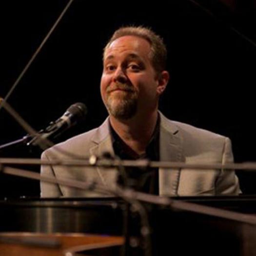 Photo of Brian Holland during a perfomance