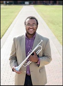 Portrait of Quinlan Gray holding a trumpet