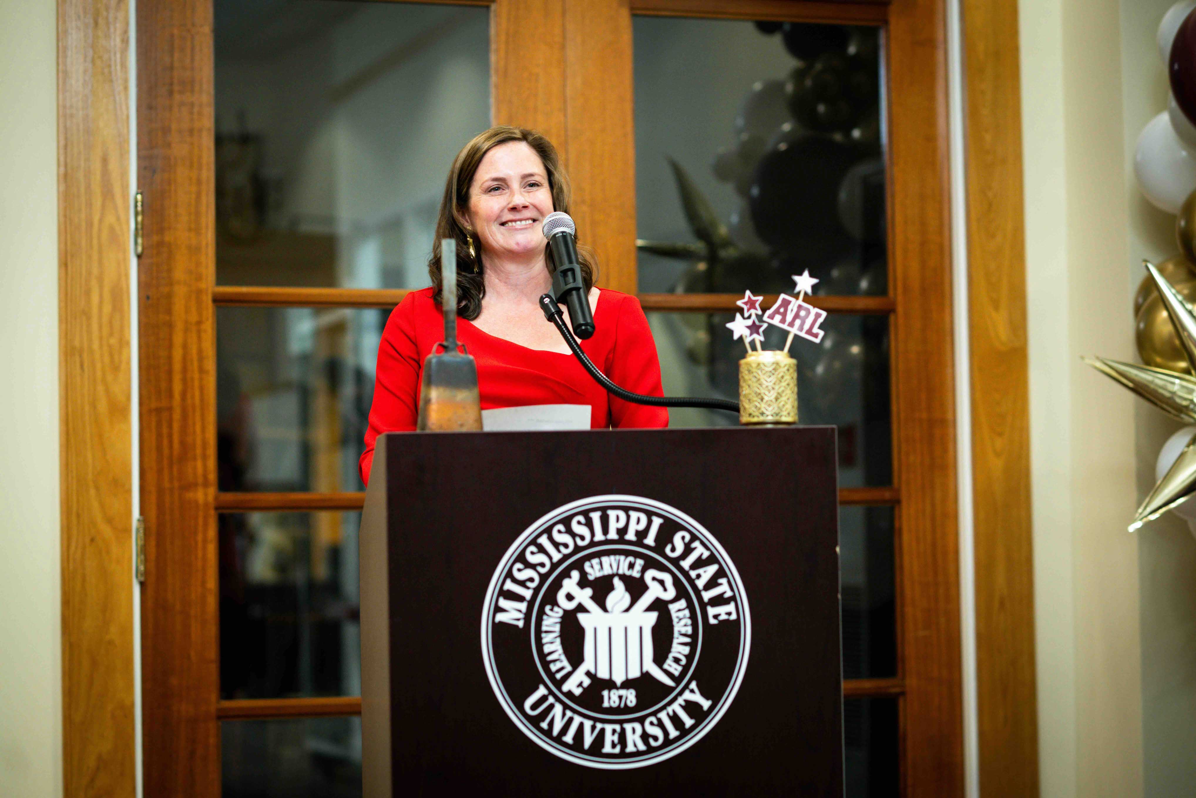 Dean of Libraries Dr. Lis Keith speaks at a podium during Mississippi State University Libraries’ celebration of Association of Research Libraries membership.