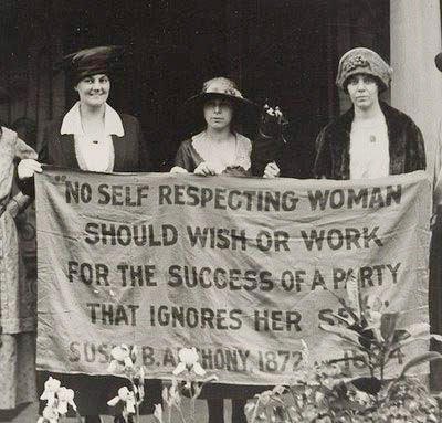Protesters holding a Susan B. Anthony quote.