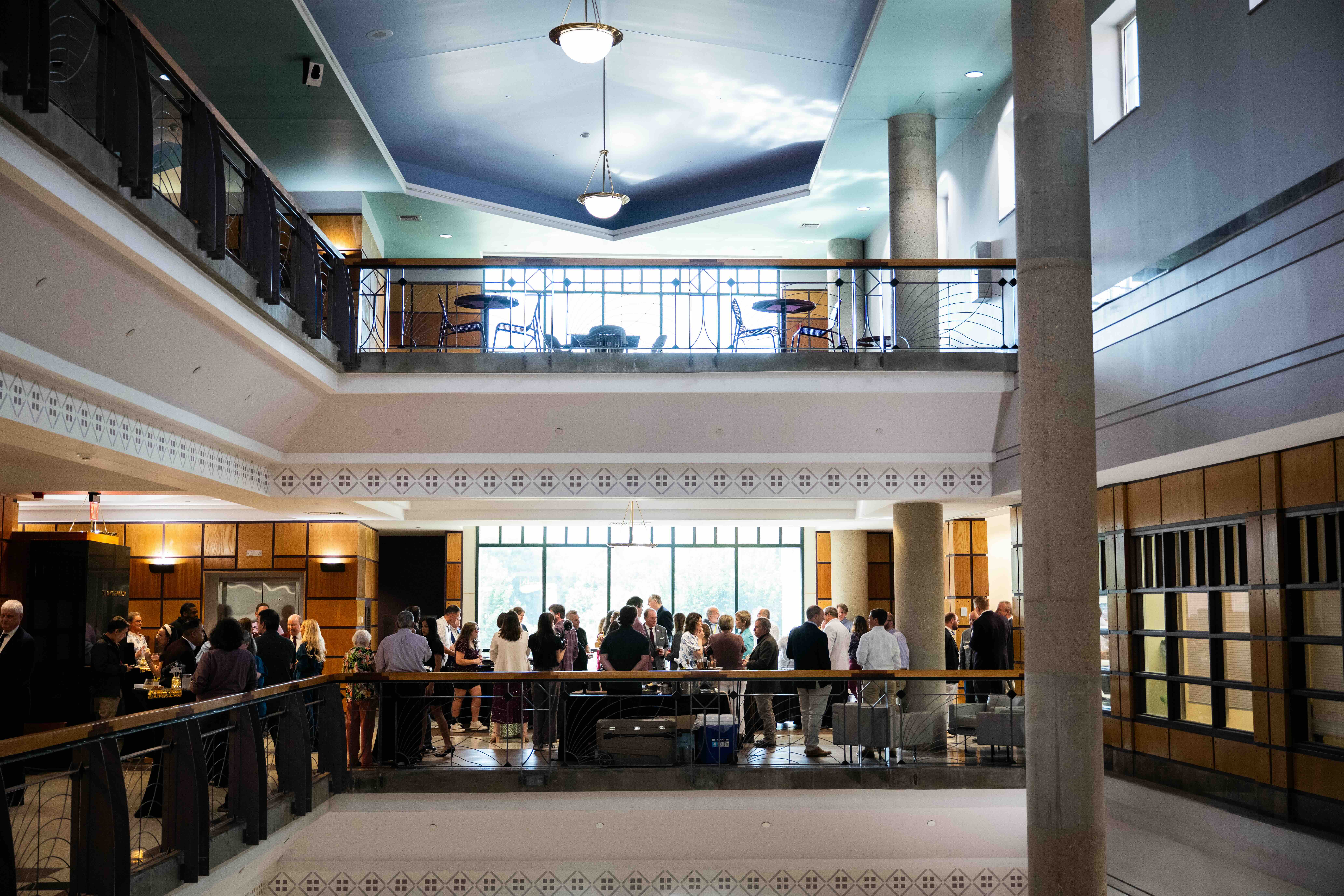 Overview of the Dean’s Event Space on the third floor of Mitchell Memorial Library, showing attendees gathered during the MSU Libraries Association of Research Libraries membership celebration.
