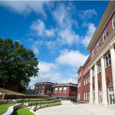 Outdoor terraced seating in front of the entrance to the Old Main Academic Center.